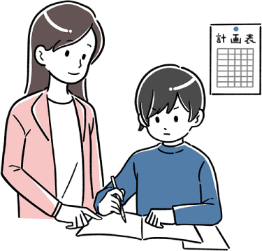 勉強する小学生の男の子と見守る女性の先生